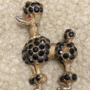 BSK poodle pendant - goldtone black stone with jeweled eye
